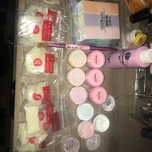 Acrylic powders, nails, brush and buffers.